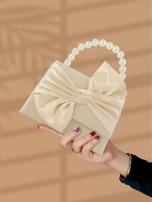 Gorgeous and elegant designed bow pearl wrist handbag,
