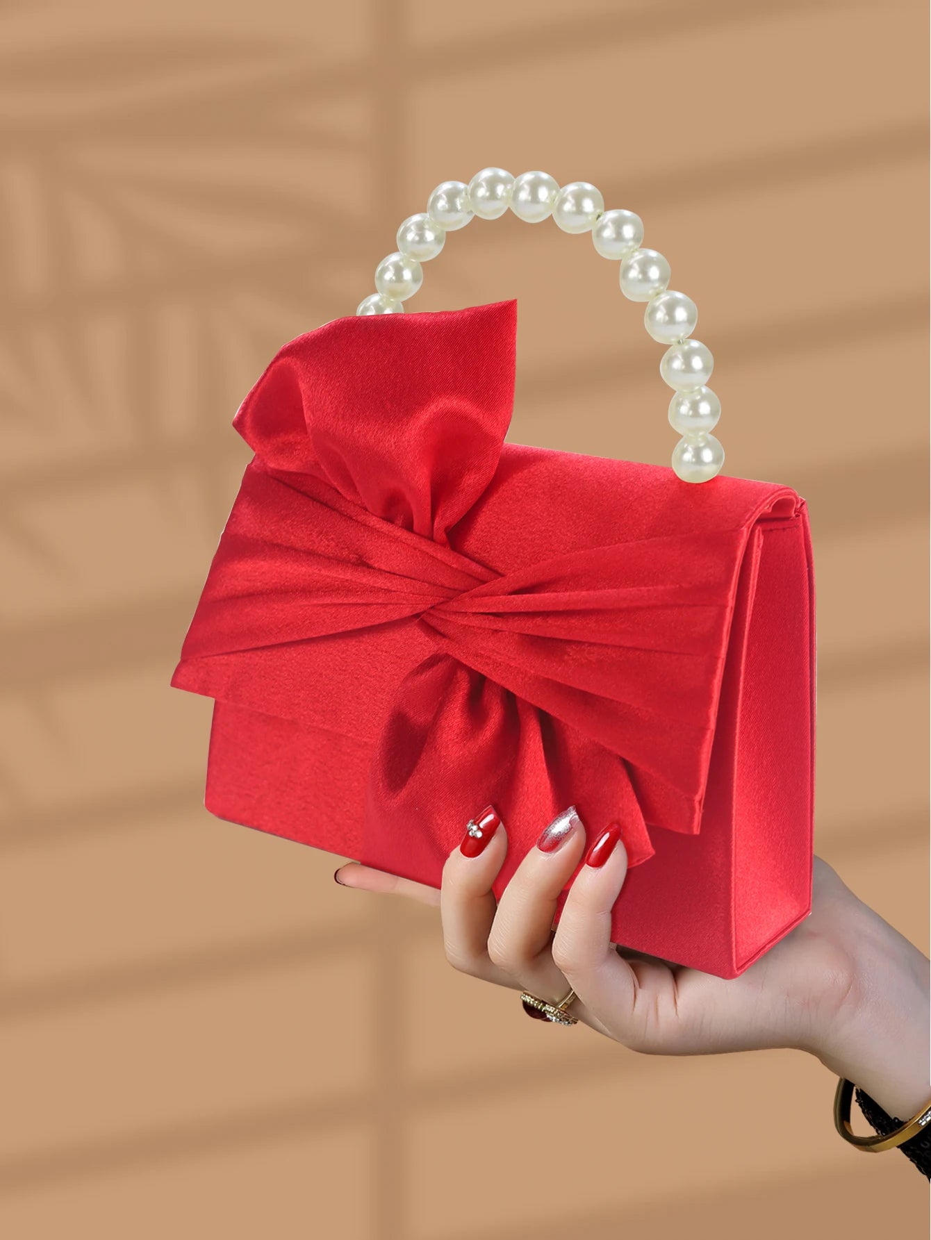 Gorgeous and elegant designed bow pearl wrist handbag,